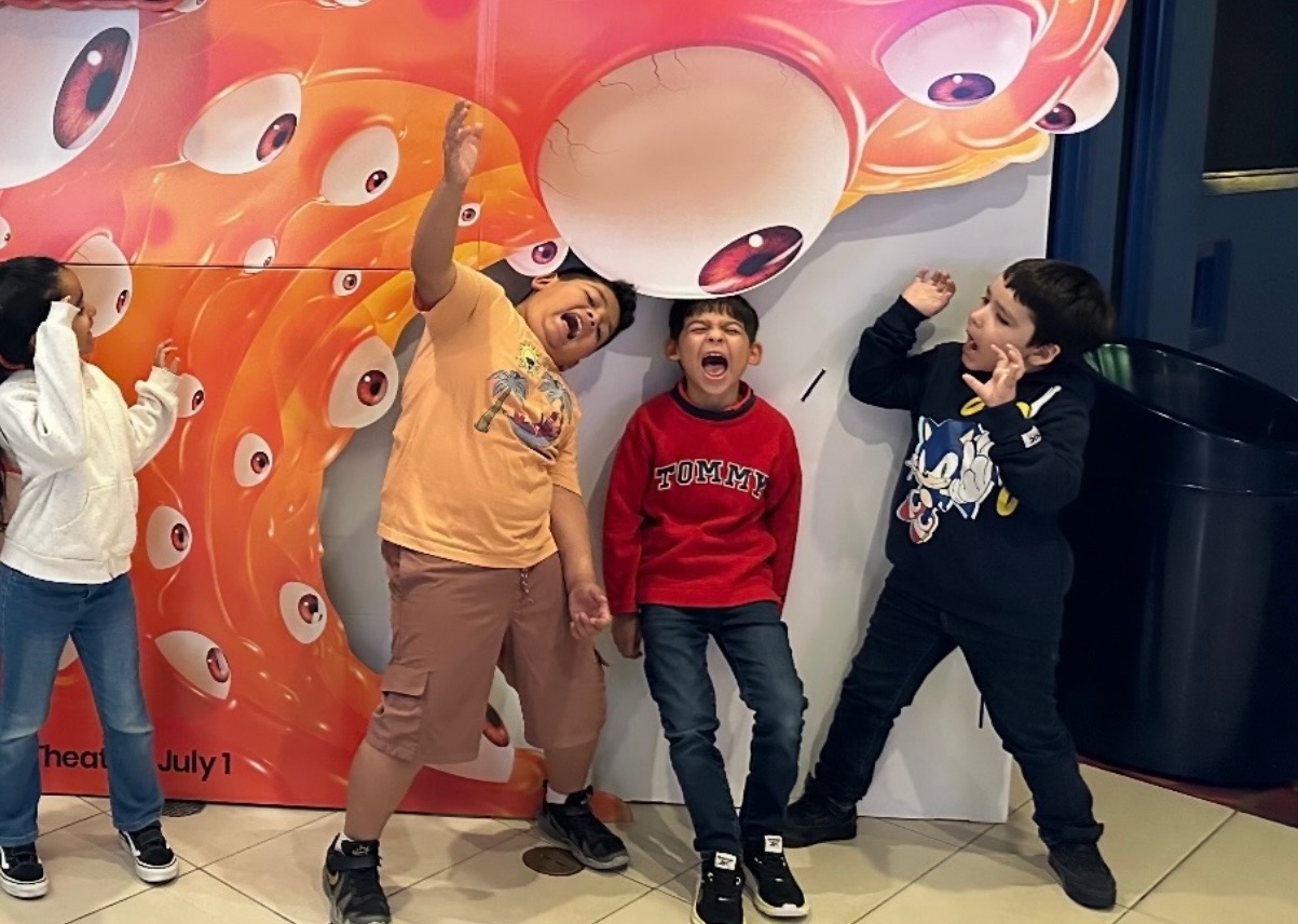 School-age children laughing together on an after-school field trip outing